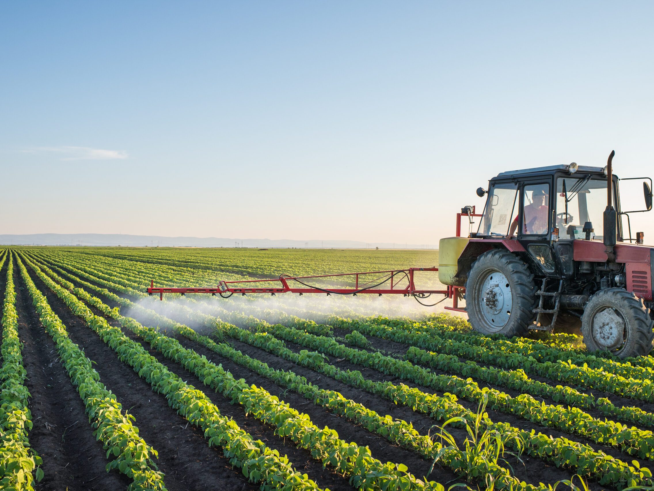 Tractor,Spraying,Soybean,Field,At,Spring
